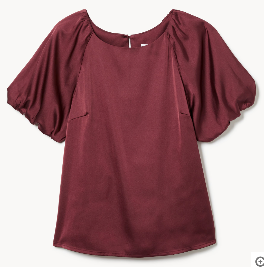 Burgundy blouse with puff sleeves and round neckline in a relaxed silhouette.