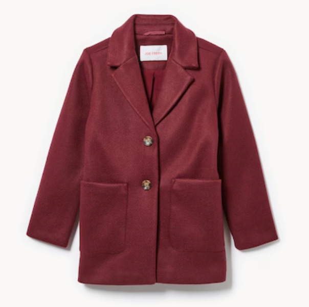 A burgundy wool coat with notched lapels, two front pockets and button closure in a classic tailored silhouette.