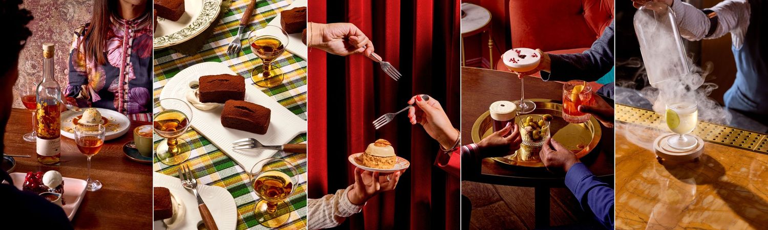 A festive holiday table setting with chocolate cake, drinks, and hands reaching for treats in warm, rich tones.