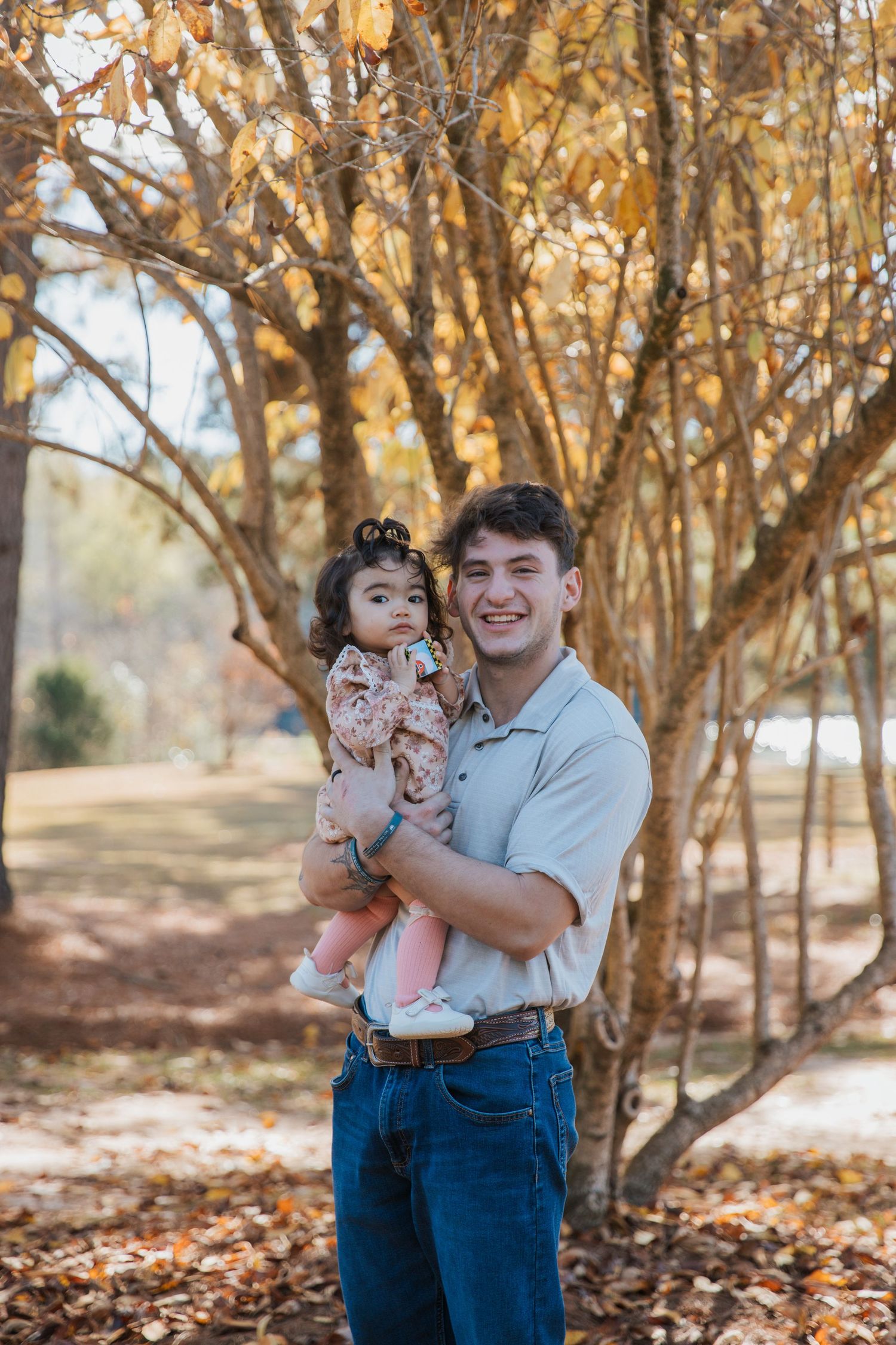 A series of fall portraits taken in a wooded area with golden autumn leaves scattered on the ground.