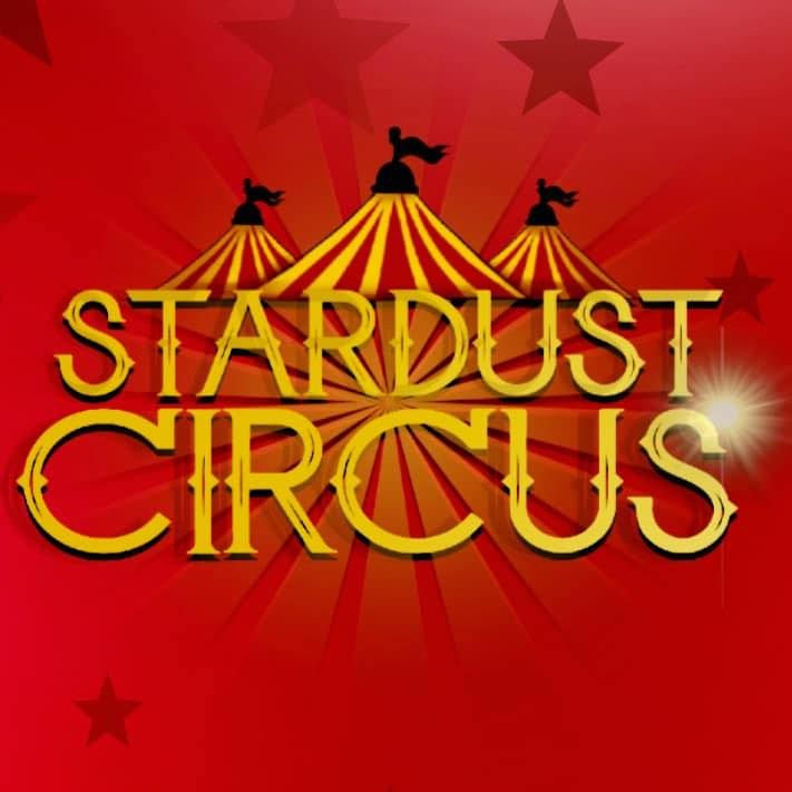 Focal Point Images
Red and gold Stardust Circus logo with tent silhouettes against starry background.