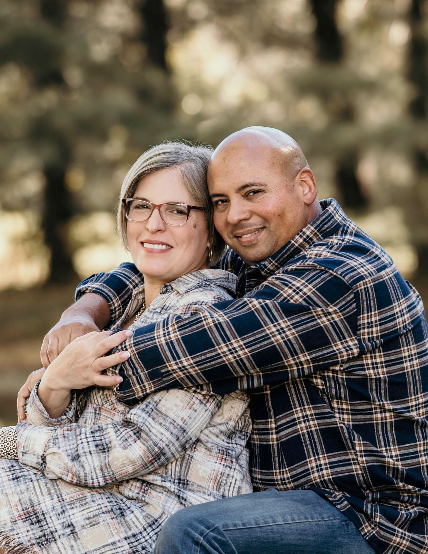 A couple embraces outdoors in a series of candid romantic photos showing affection and laughter.