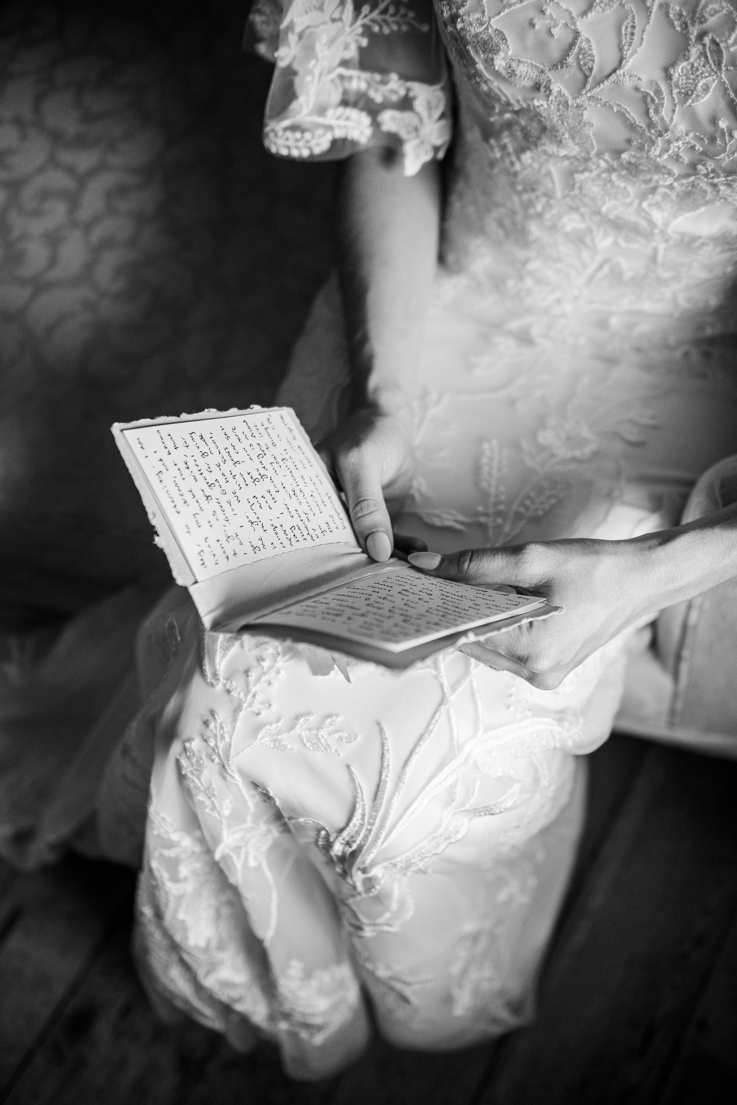 A series of black and white photographs showing gloved hands examining what appears to be an ancient manuscript or document.