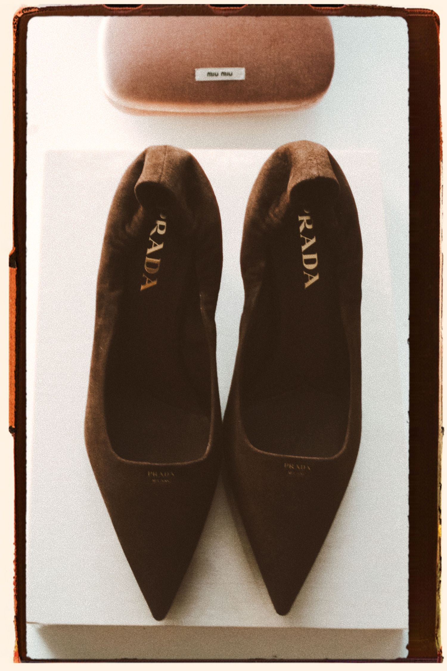 Vintage-style photos of black pointed shoes arranged in pairs.