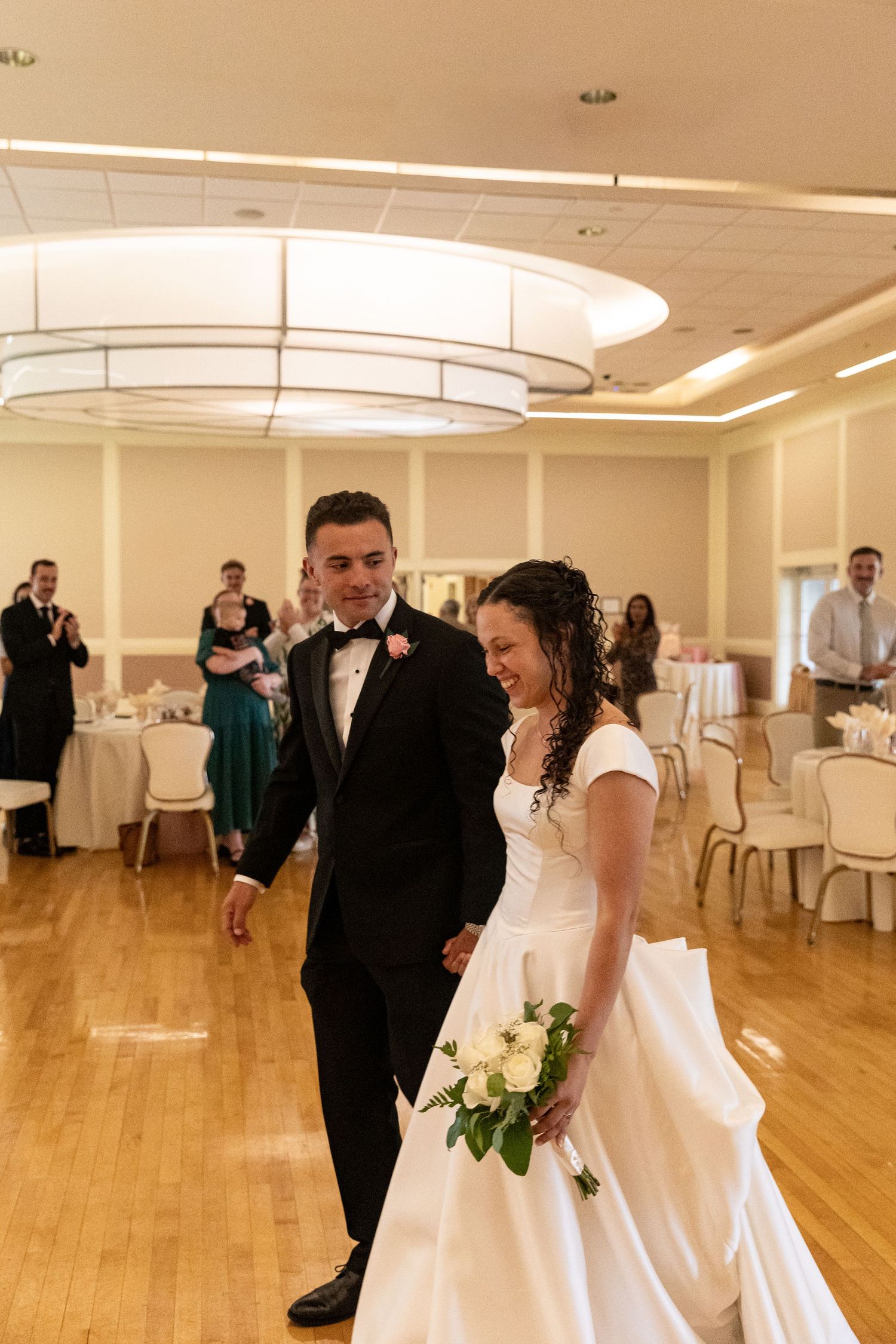 military couple making their grand entrance during their wedding reception on camp jejune military base