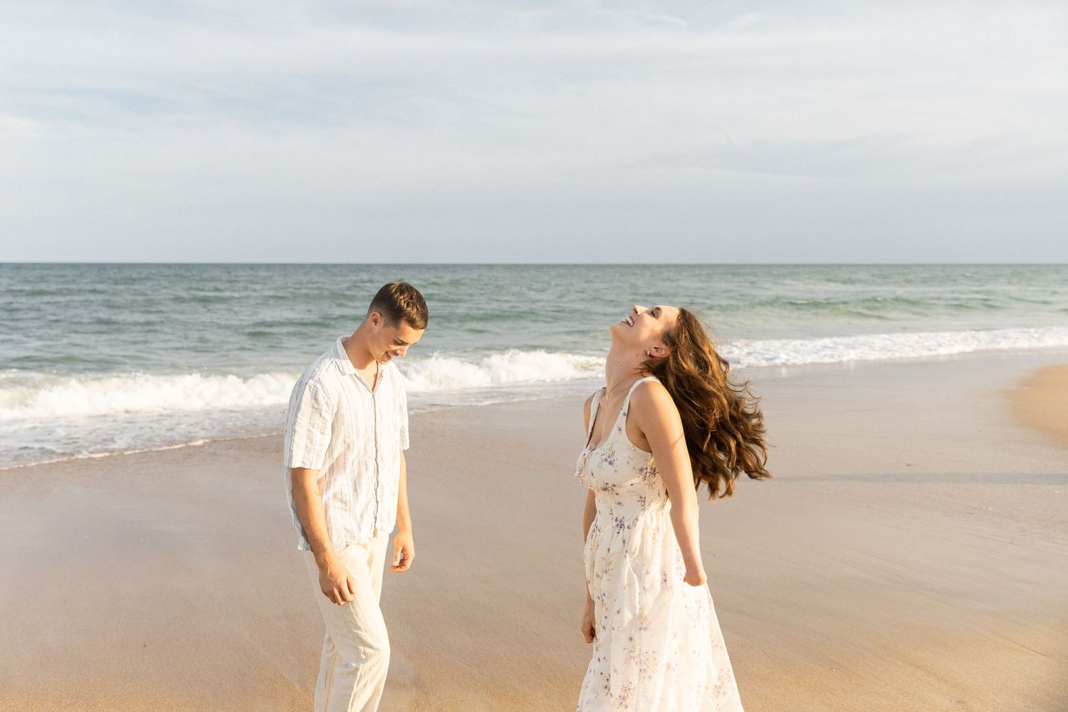 Candid couple laughing during a Topsail Beach photo session