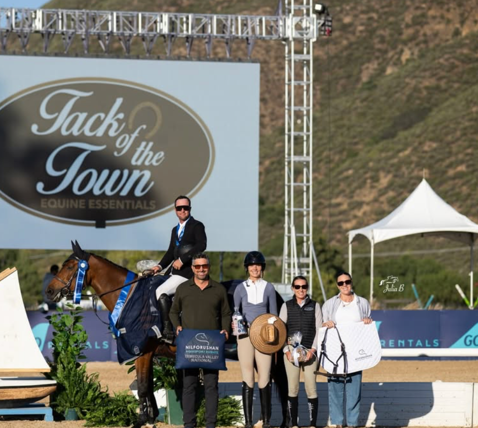 Sean Leckie wins 1.35 Welcome. Equestrian riders and horse pose at Tack of the Town Equine Essentials sponsored award ceremony.