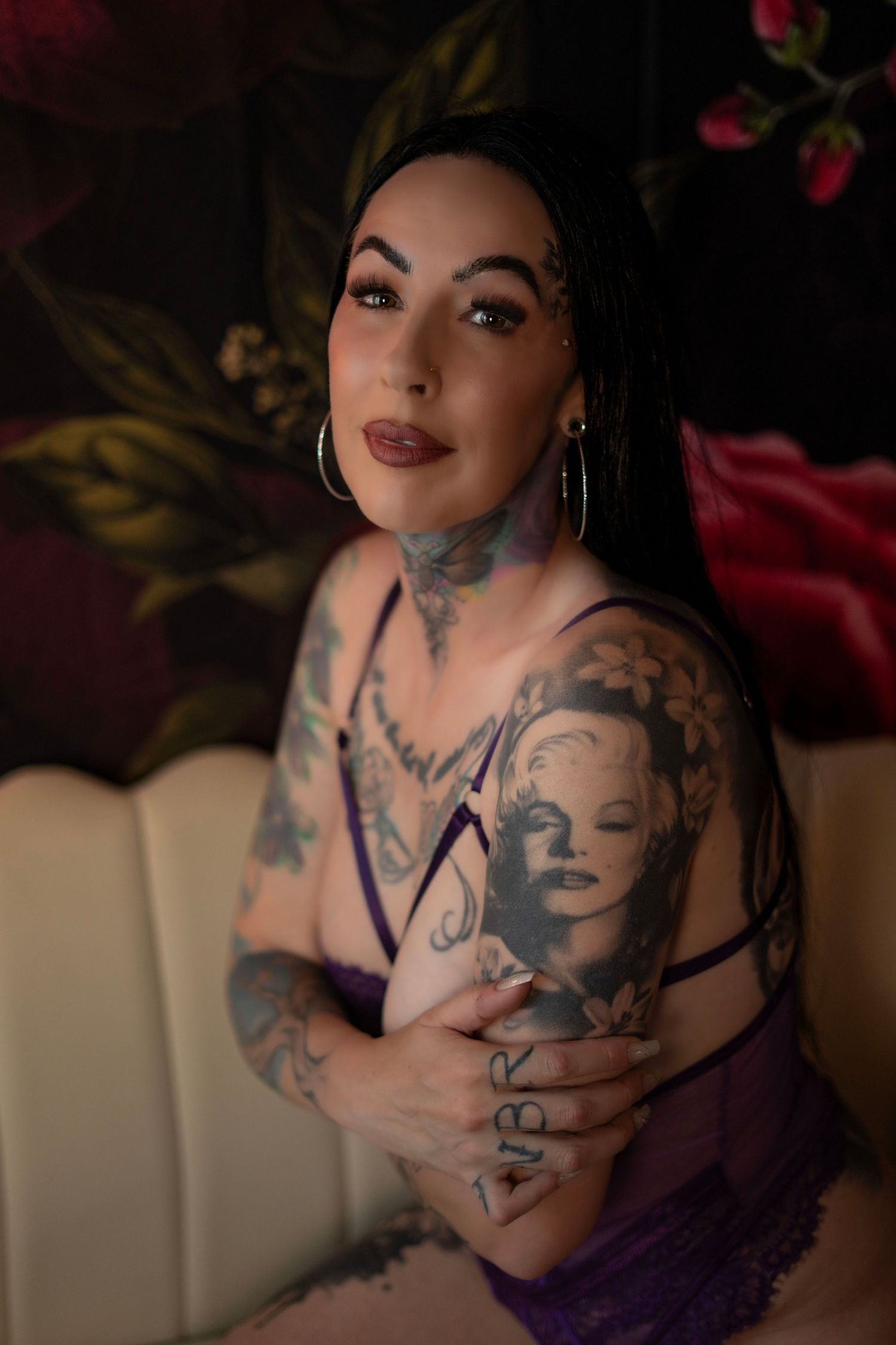 moody boudoir session on a dark studio backdrop in Minnesota