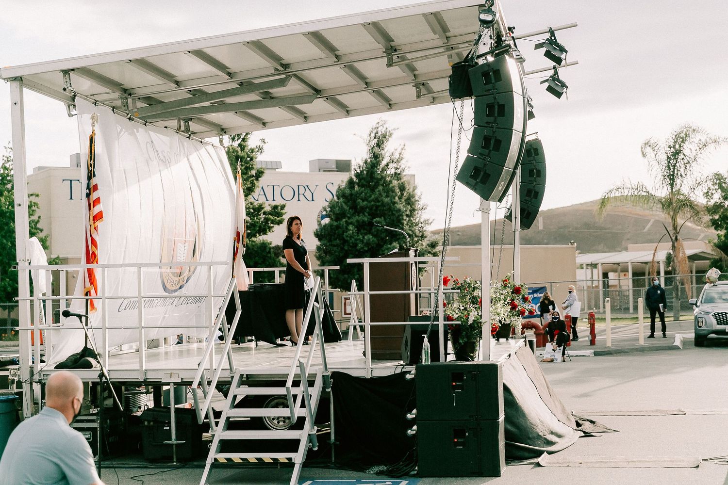 Outdoor graduation stage setup with speakers and scaffolding at Temecula Preparatory School.