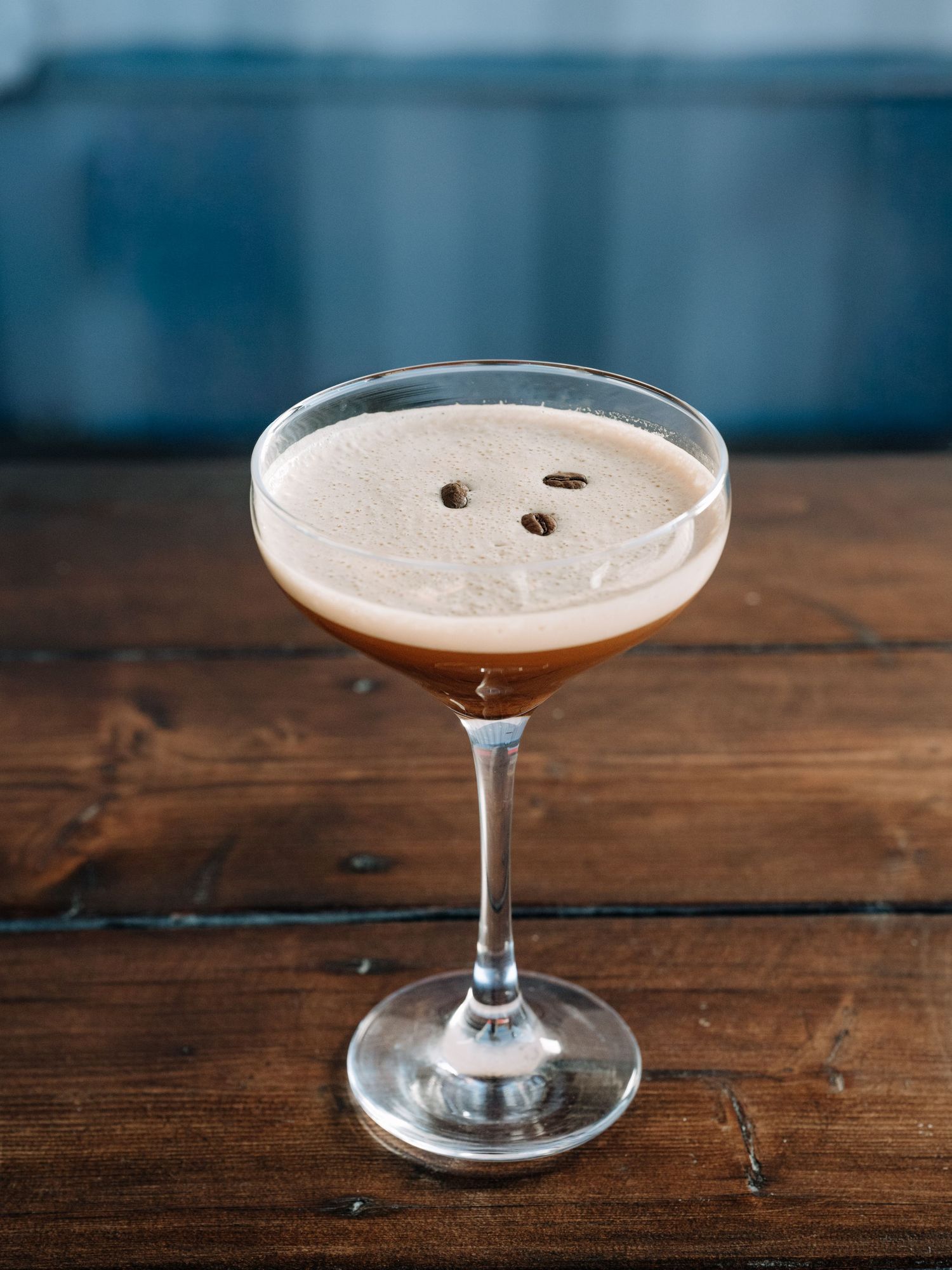 Close-up espresso martini with coffee beans on top — cinematic food and beverage photography by James Fujita in Kelowna, Okanagan Valley.