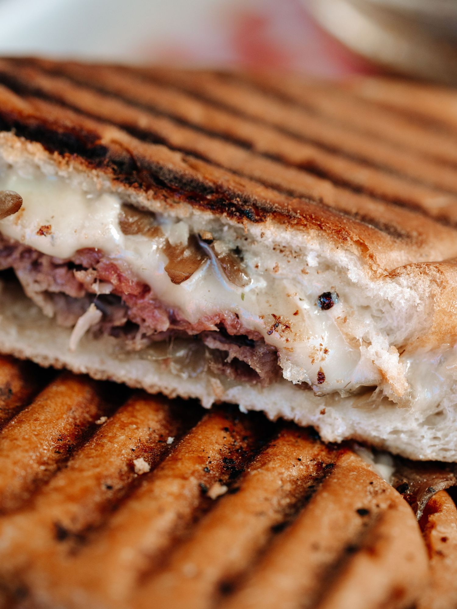 Pressed panini sandwich with melted cheese — Kelowna café lifestyle photo by James Fujita.