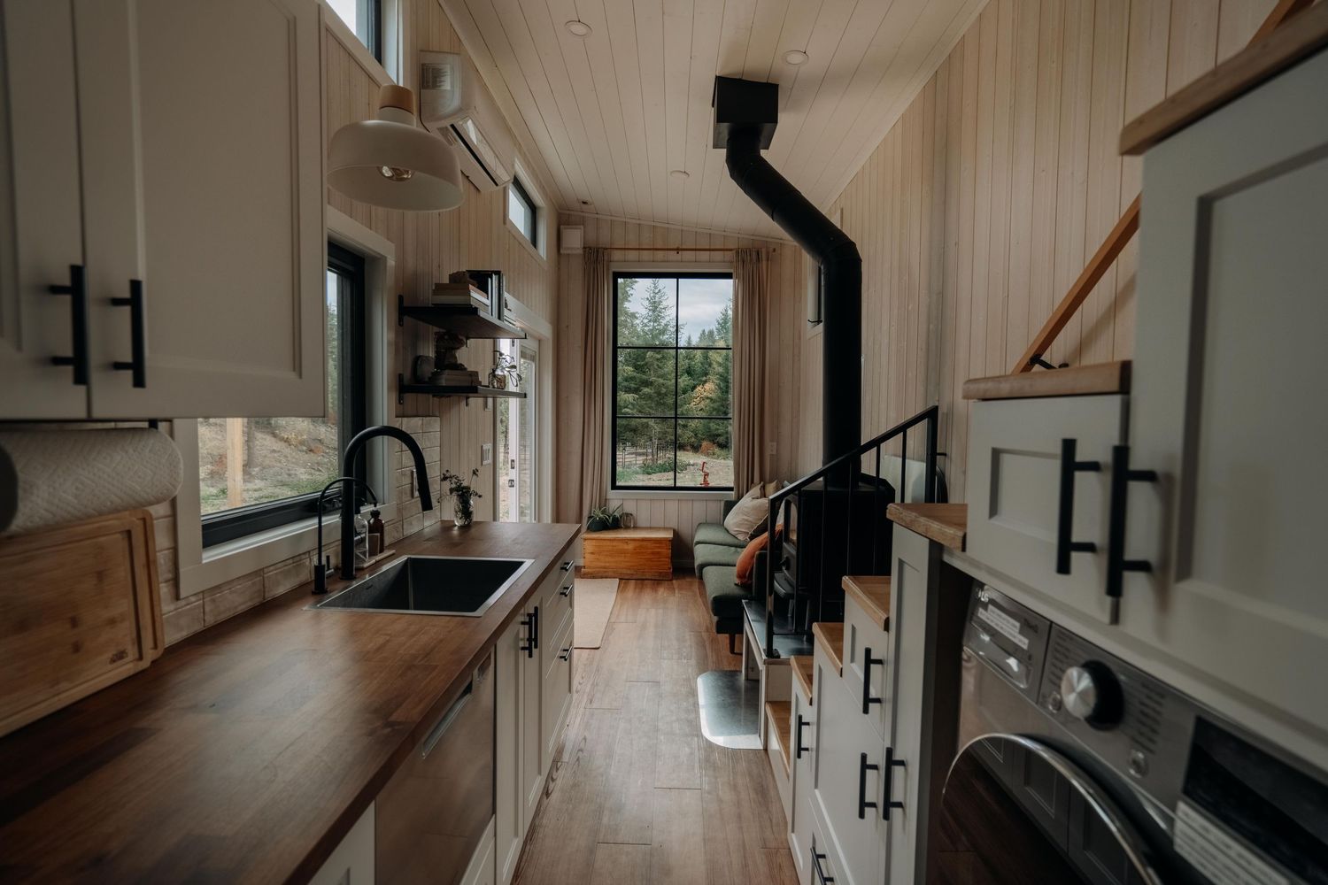 Cozy tiny home kitchen with natural wood and modern design — interior photography by James Fujita, Kelowna BC.