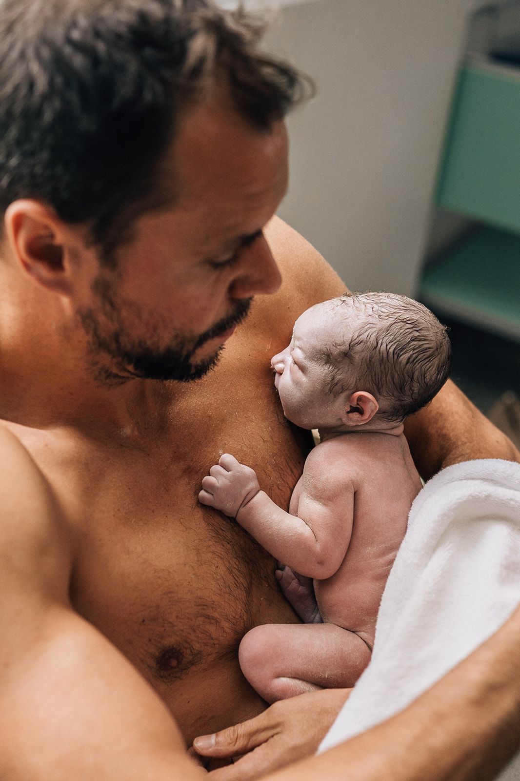 dad holding his baby during a birth photoshoot in dubai
