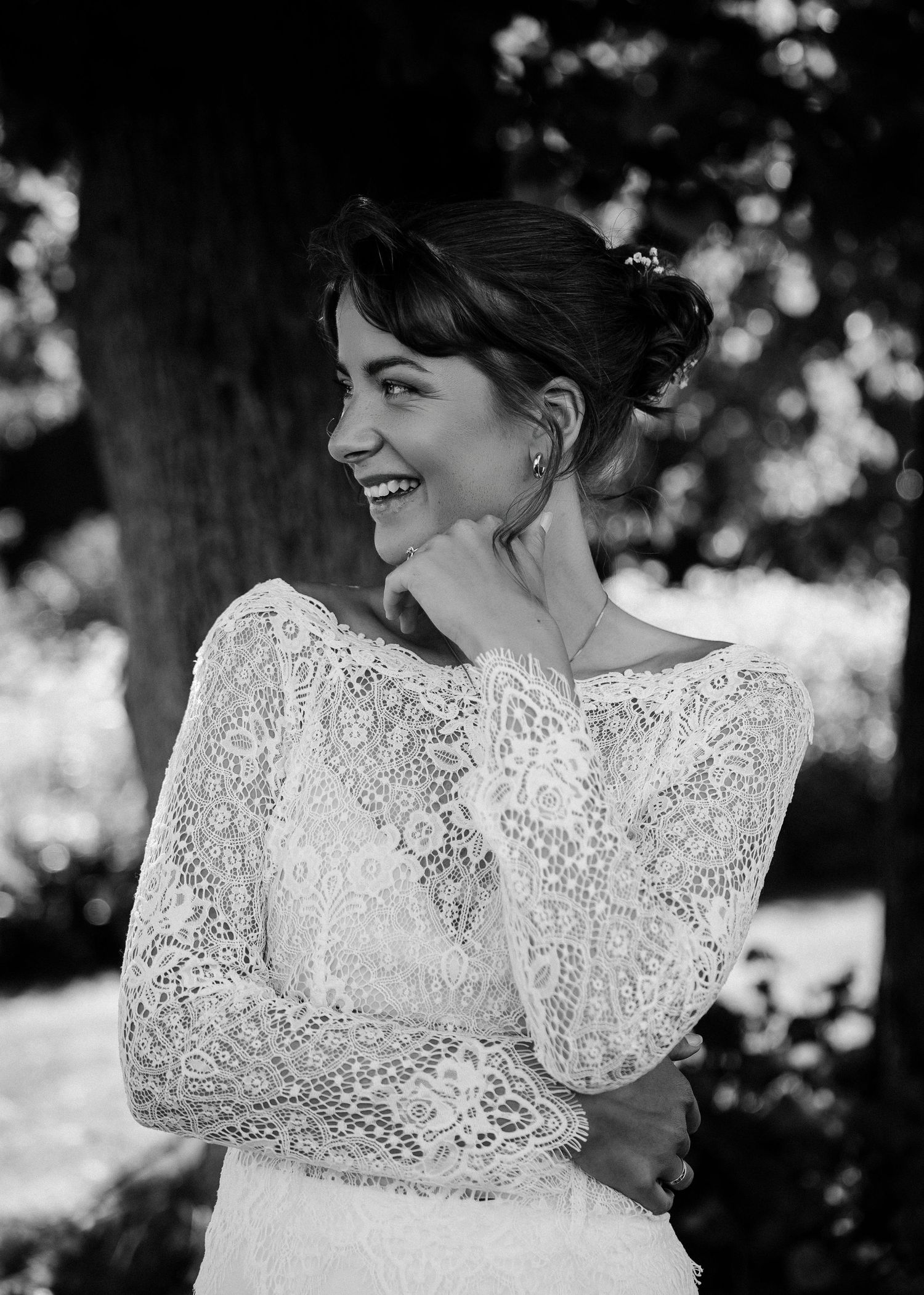 Black and white portrait series showcasing intricate lace wedding dress details.