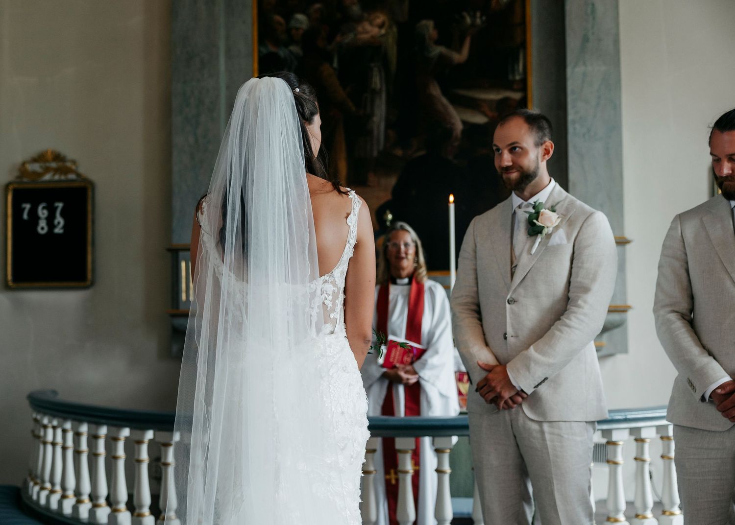 Wedding ceremony moments captured in a historic church with elegant architecture.