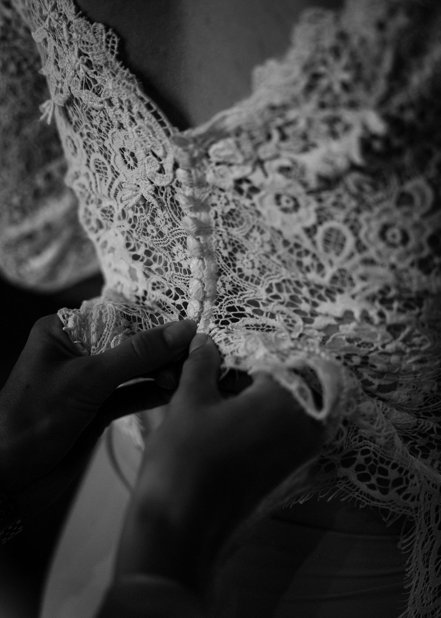 Delicate lace details captured in black and white close-up shots.