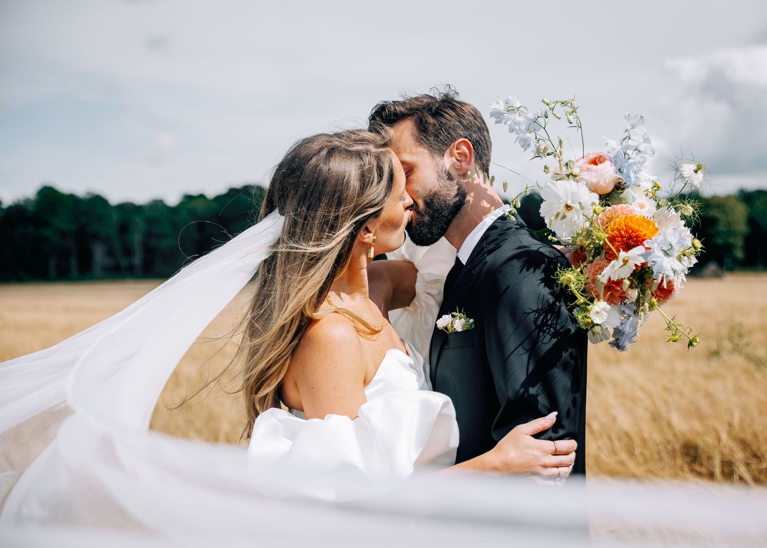 Artistic wedding photography sequence showing couple in wheat field with flowing veil.