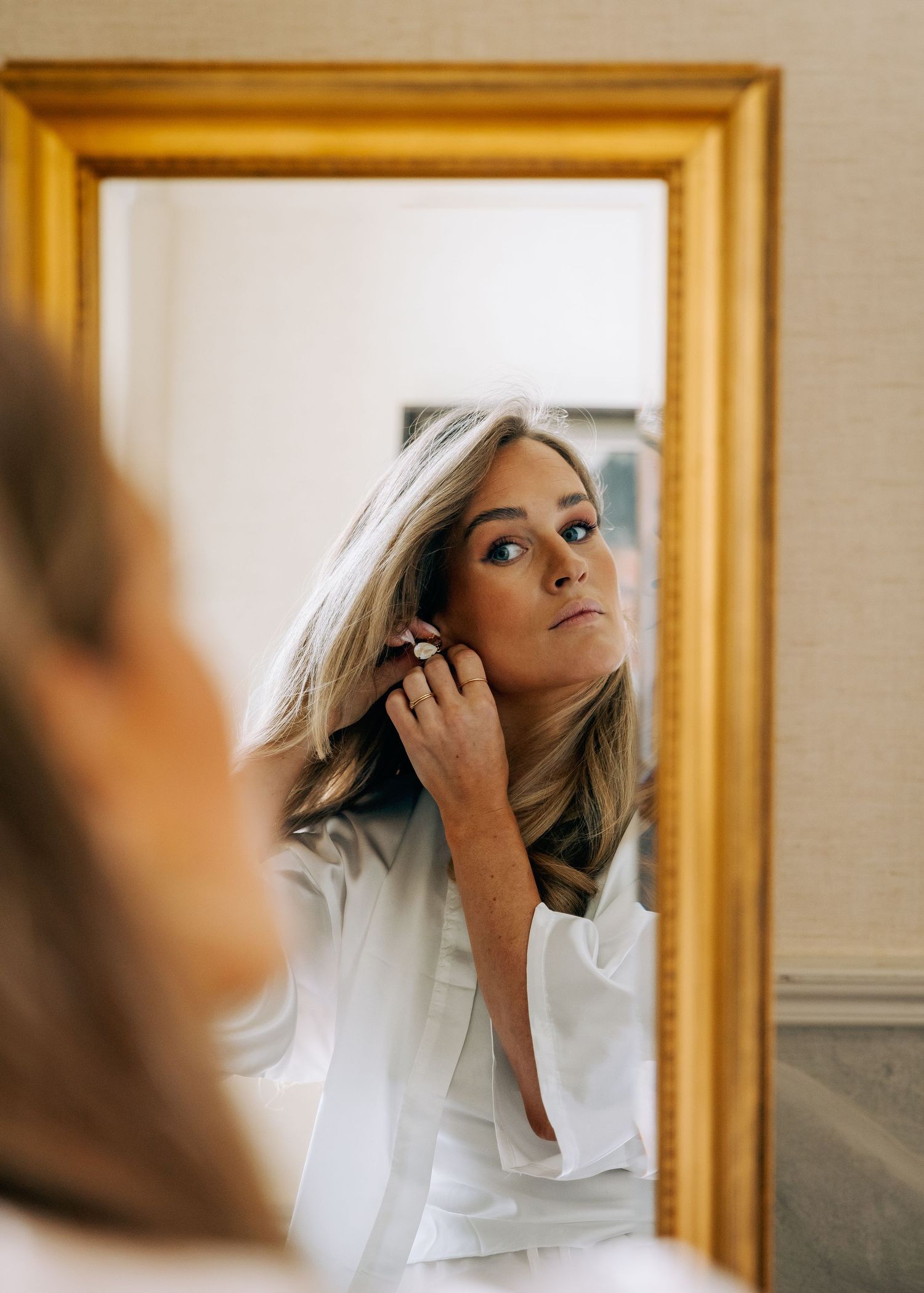 Mirror reflection showing preparation with gold frame.