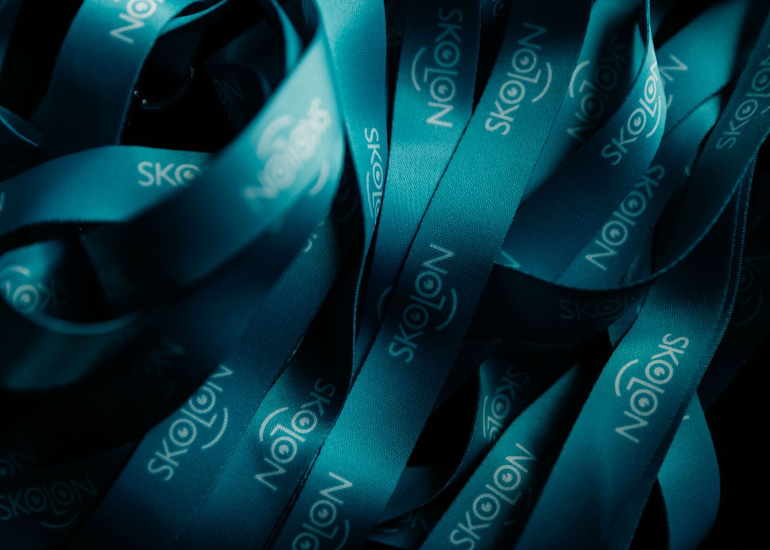 Keyboard keys with blue lighting and swirled patterns creating an abstract technological background.