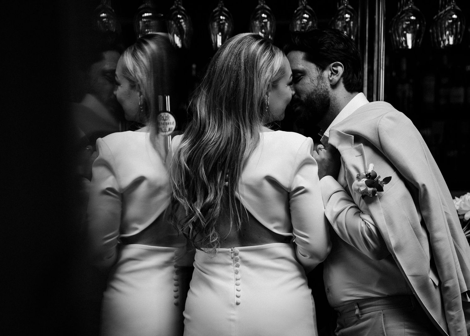 Black and white close-up sequence of a romantic couple sharing intimate moments at a wedding.