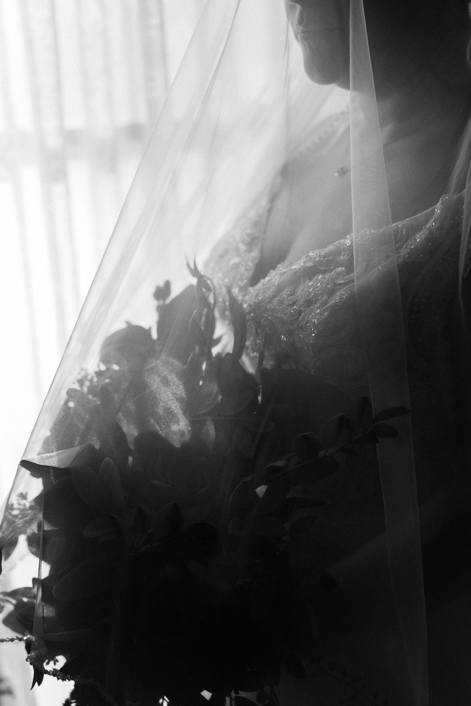 Dramatic black and white photo series showing a cloud-like formation with ethereal light beams streaming through dark shapes.