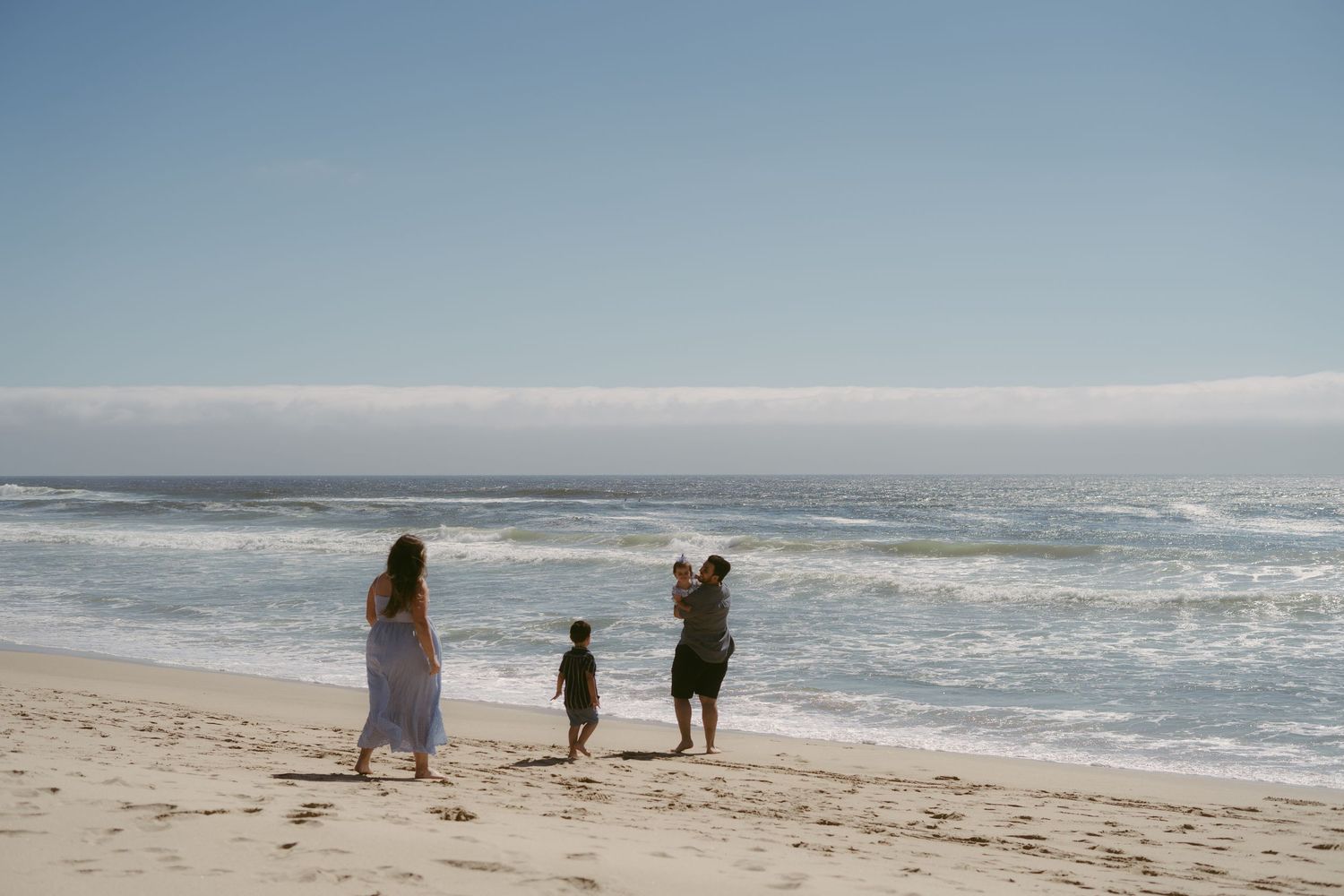 family walking to beach