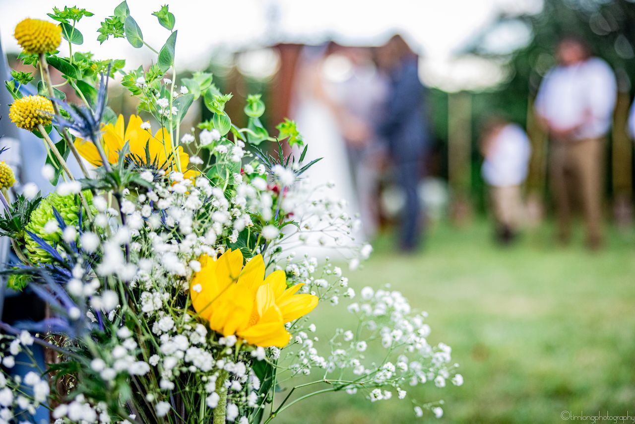 Close-up of yellow and white floral bouquet arrangements with soft focus background.