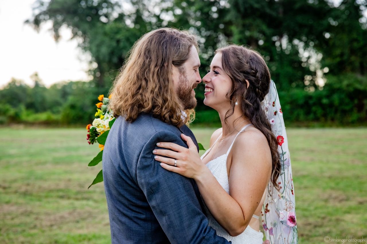 Romantic outdoor wedding moments captured in natural lighting with autumn foliage.