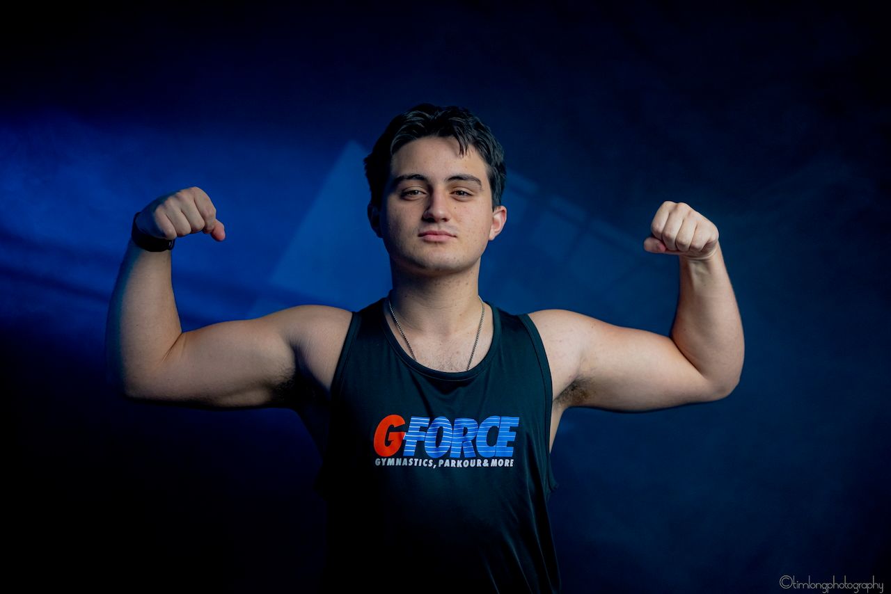 Series of athletic fitness poses against dramatic blue lighting background.