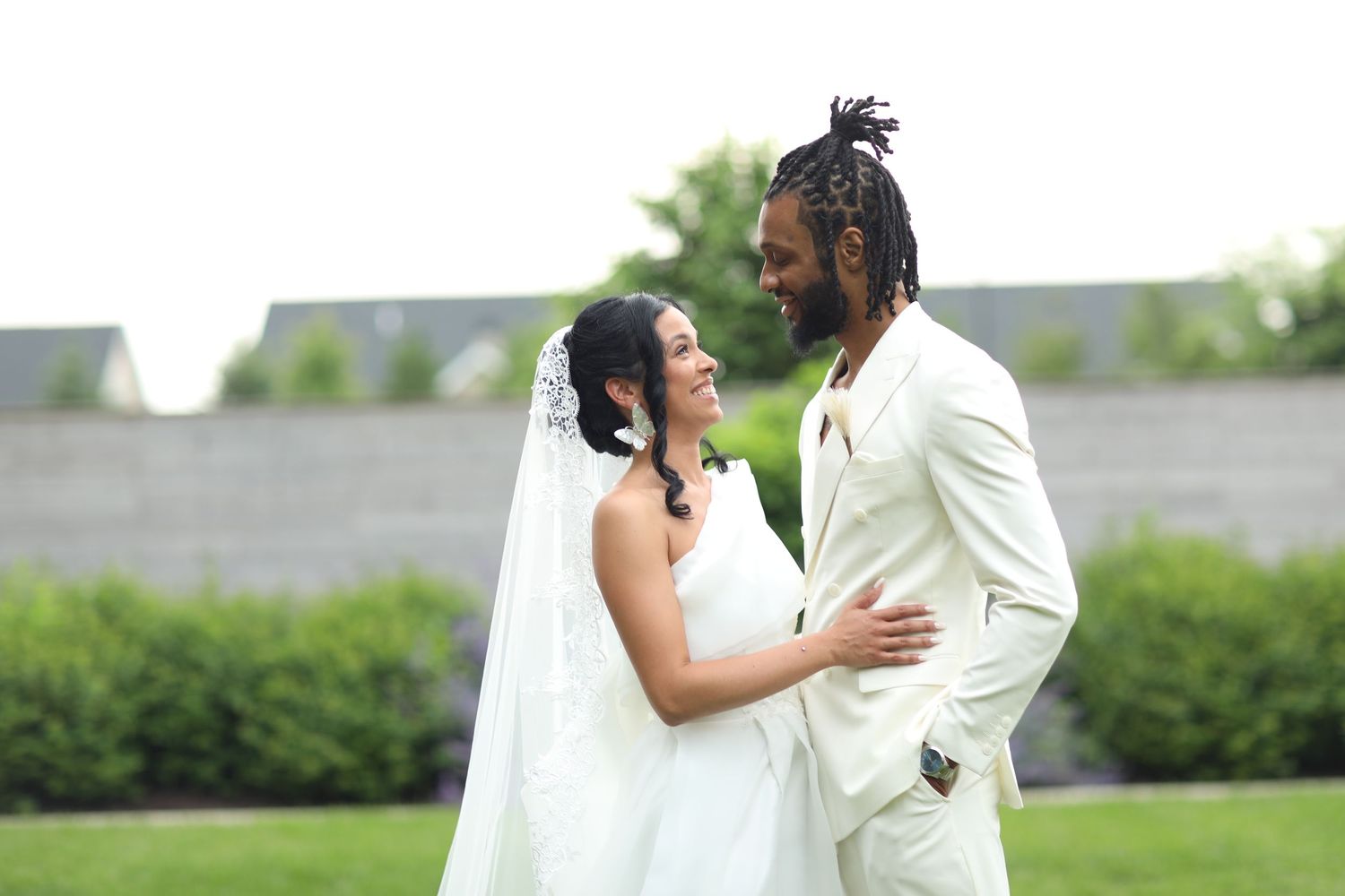 A romantic outdoor wedding photo sequence showing tender moments between the newlyweds.