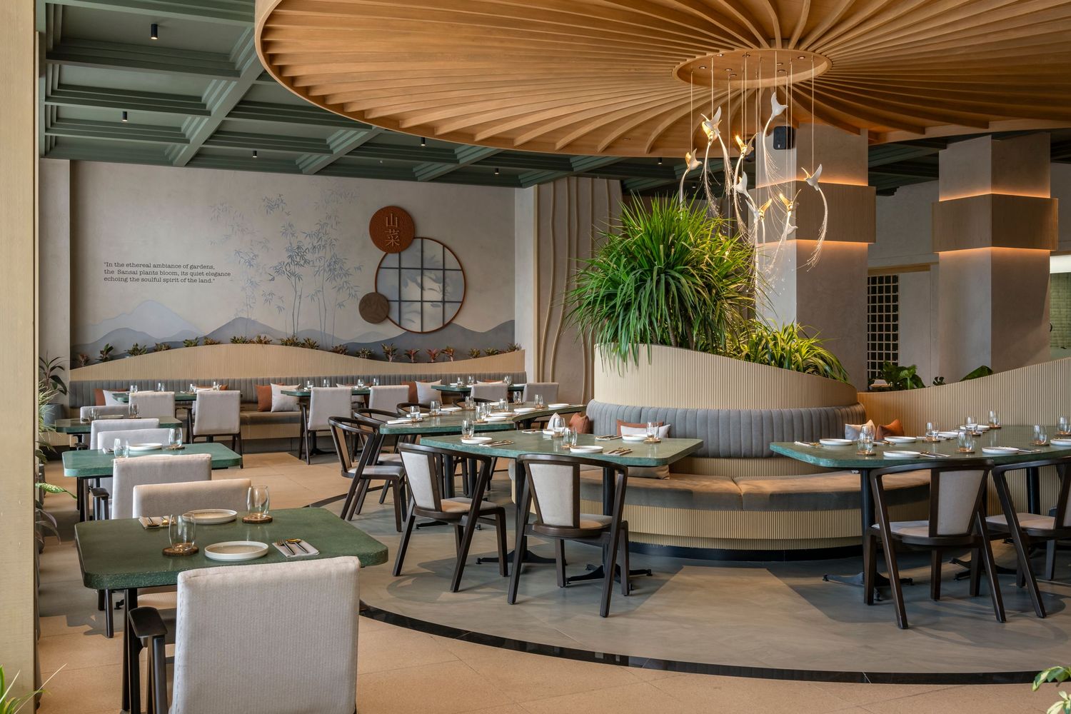 Modern restaurant interior with curved booth seating, wooden ceiling details, and Asian-inspired mural wall decor.