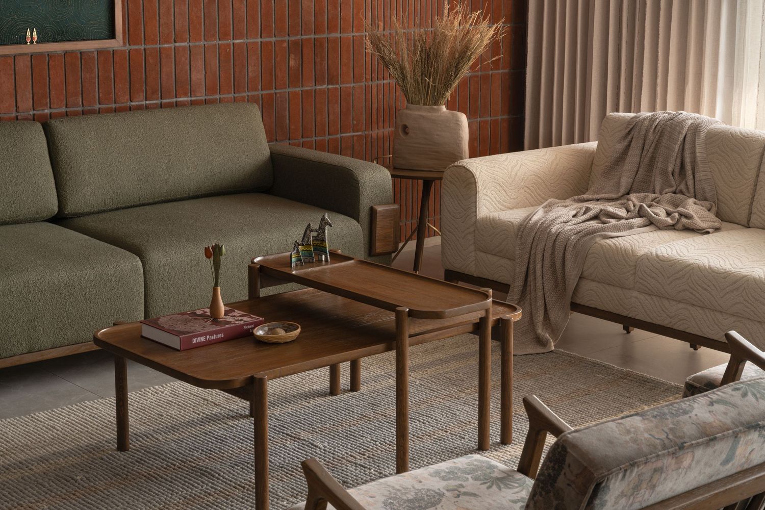 Mid-century modern living room with olive green sofa, walnut coffee tables, and warm ambient lighting.