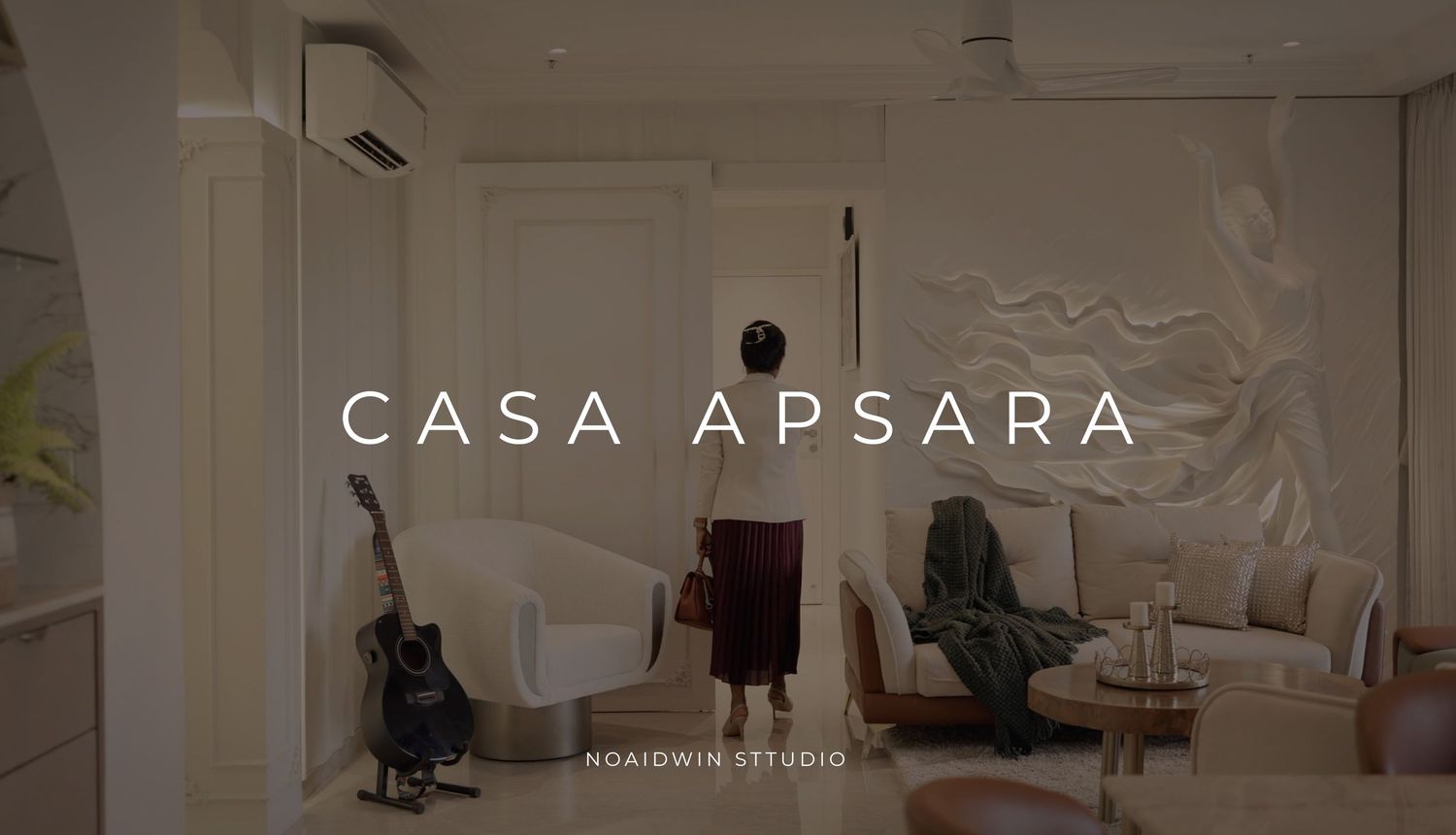 Casa Apsara modern interior design project by Noaidwin Studio featuring a bright living space with guitar and elegant furnishings.