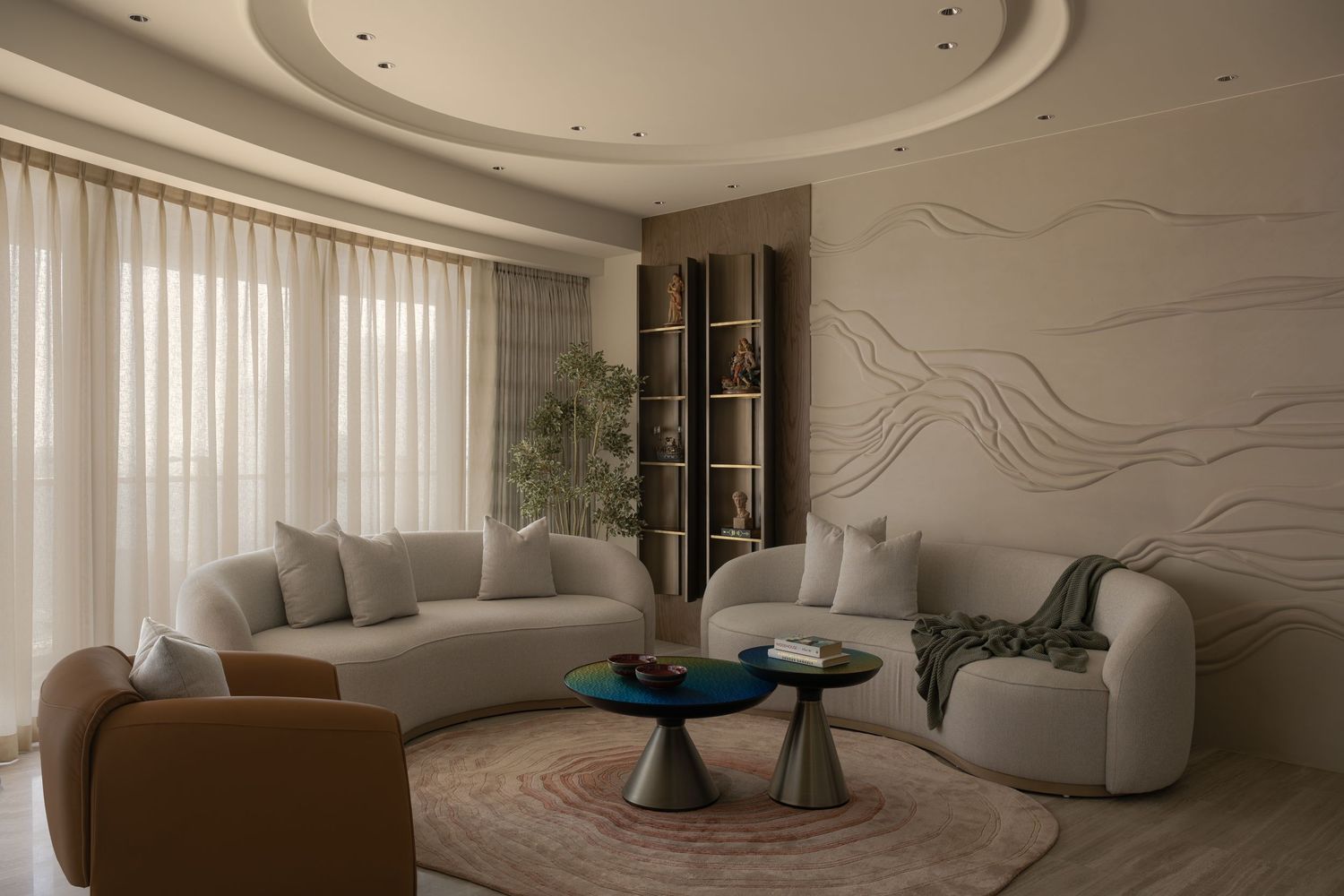 Curved contemporary living room with white sofas, teal coffee table, textured wall art, and round ceiling.