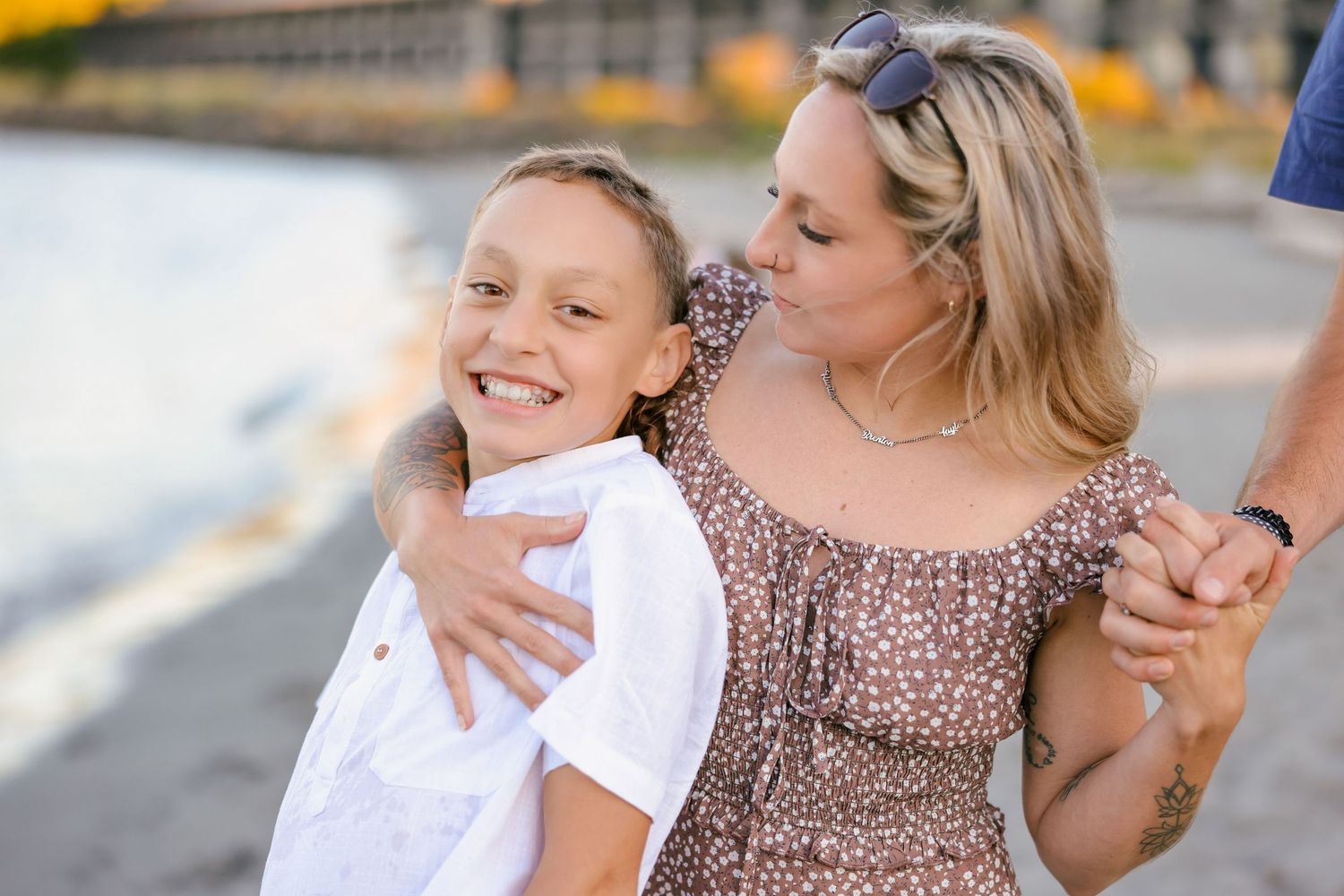 Joyful family moments captured during sunset beach photography session.