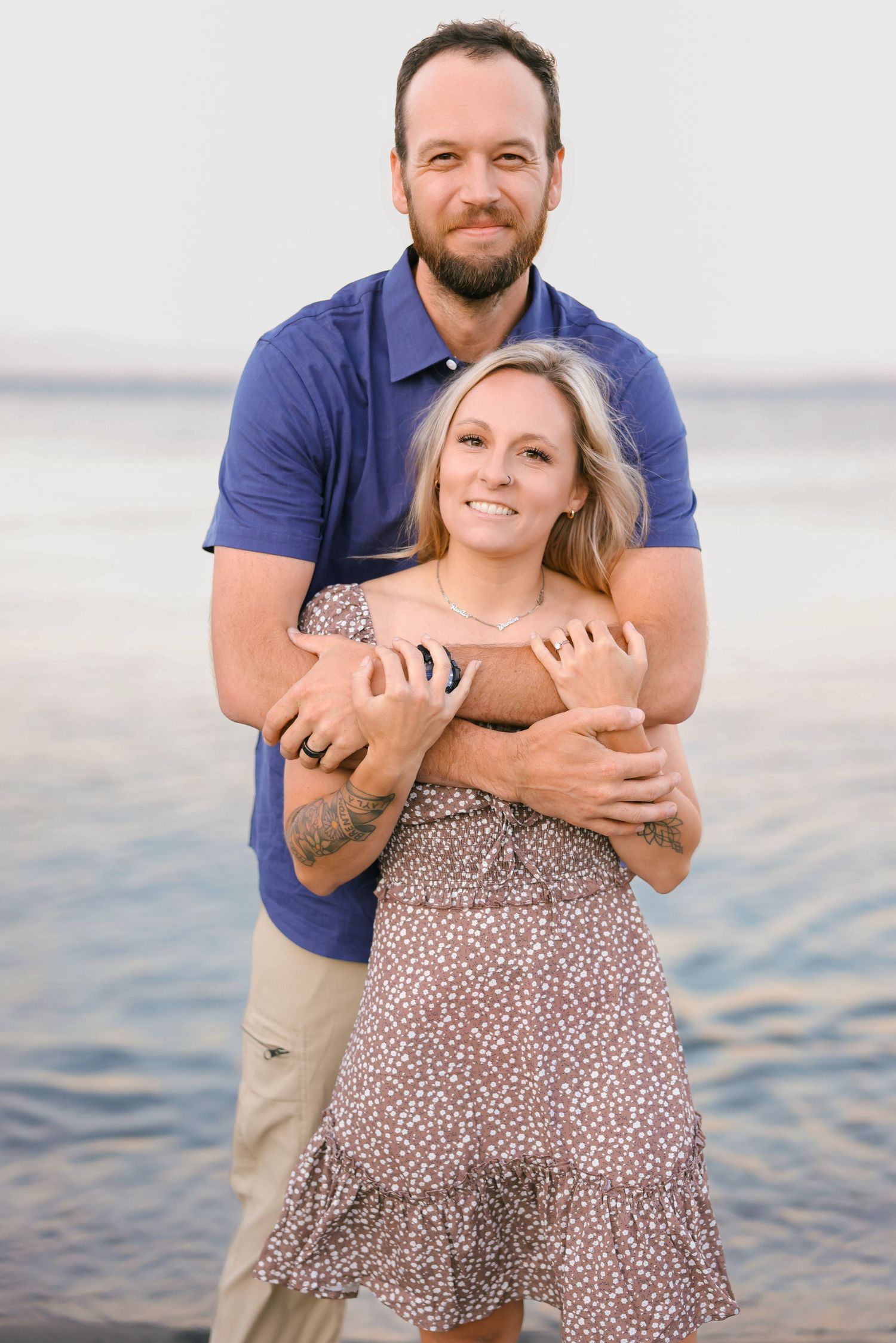 A couple shares a playful moment at the beach in a series of candid photos showing affection and laughter.