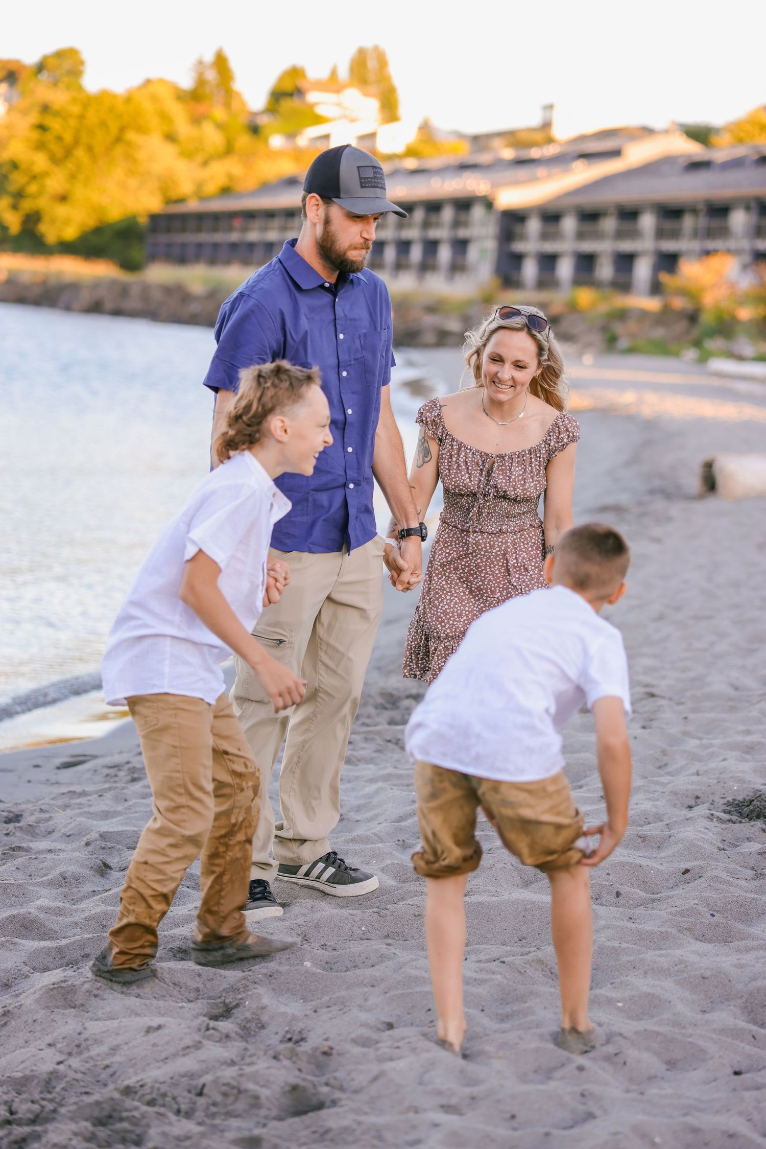 Playful family moments captured on sandy beach during golden hour.