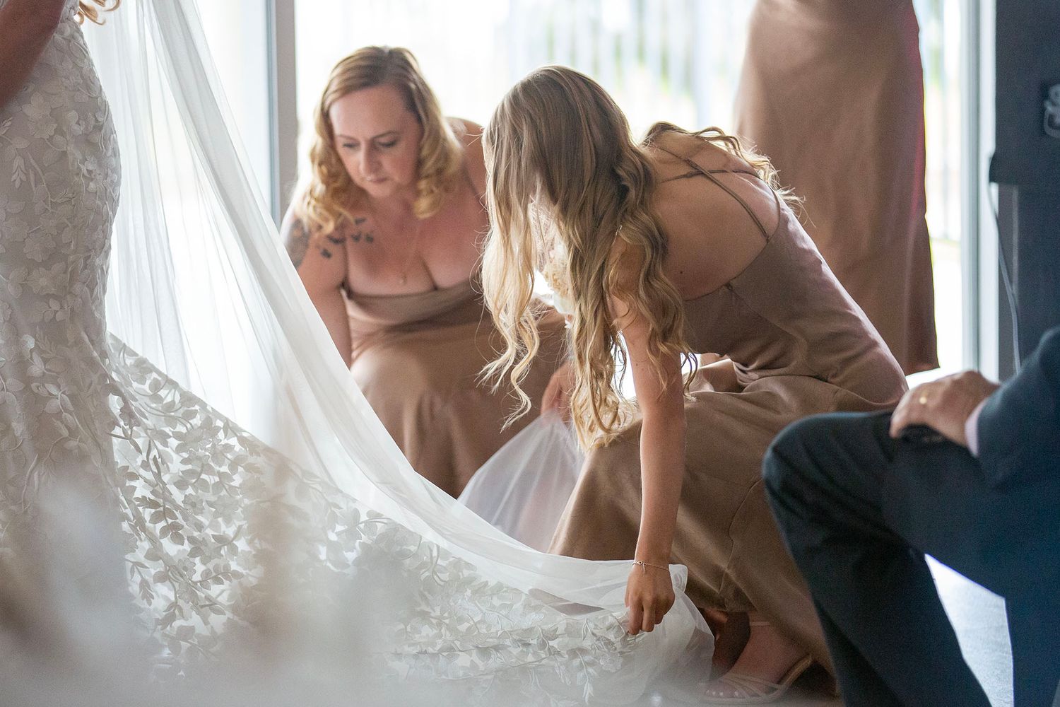 Wedding preparation scene with delicate veil and soft natural lighting.