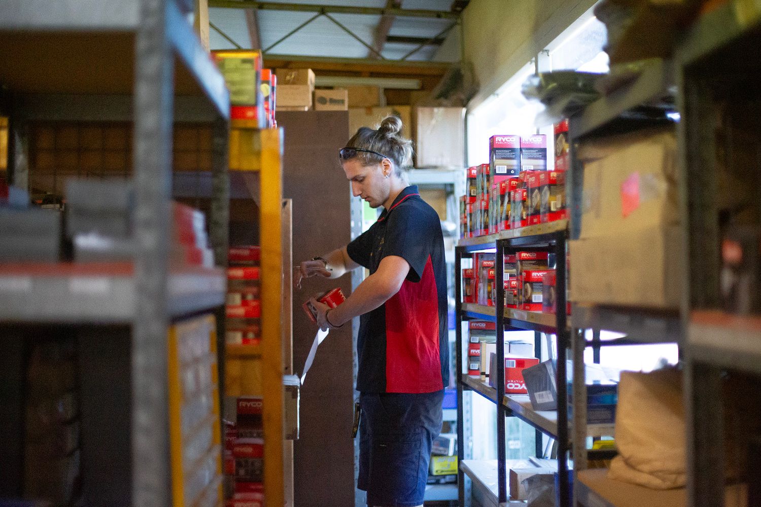 Service bay area of automotive repair shop with lifts and equipment.