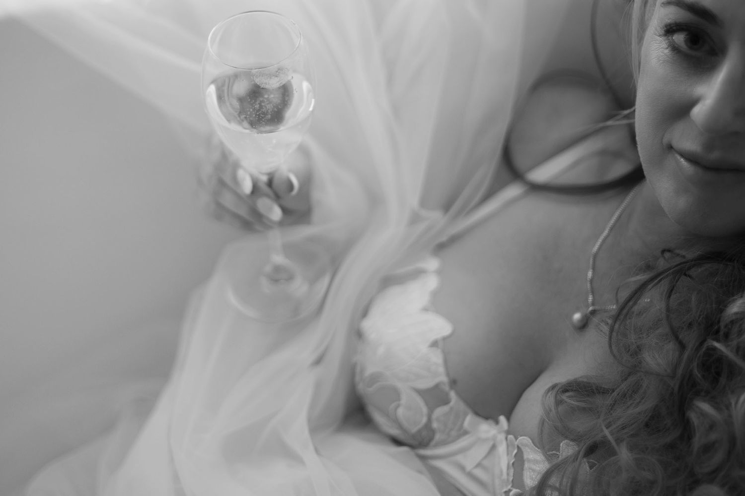 Monochrome close-up photo with delicate veil detail.