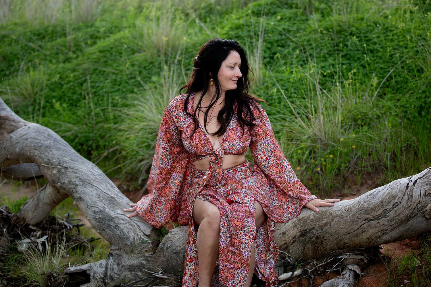 A floral dress captured in multiple artistic poses against a natural outdoor setting.