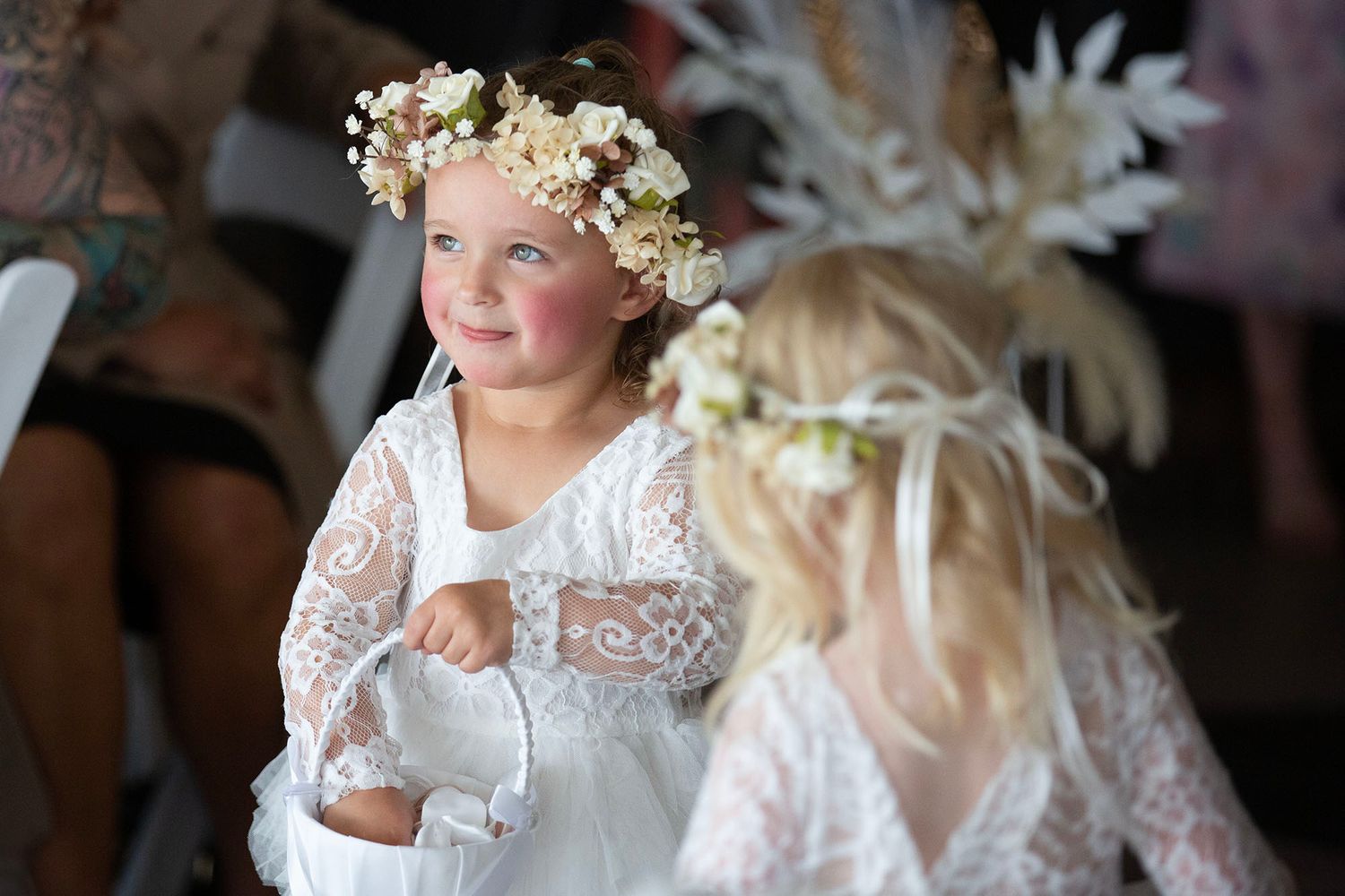 Wedding celebration featuring delicate white floral crown accessories.