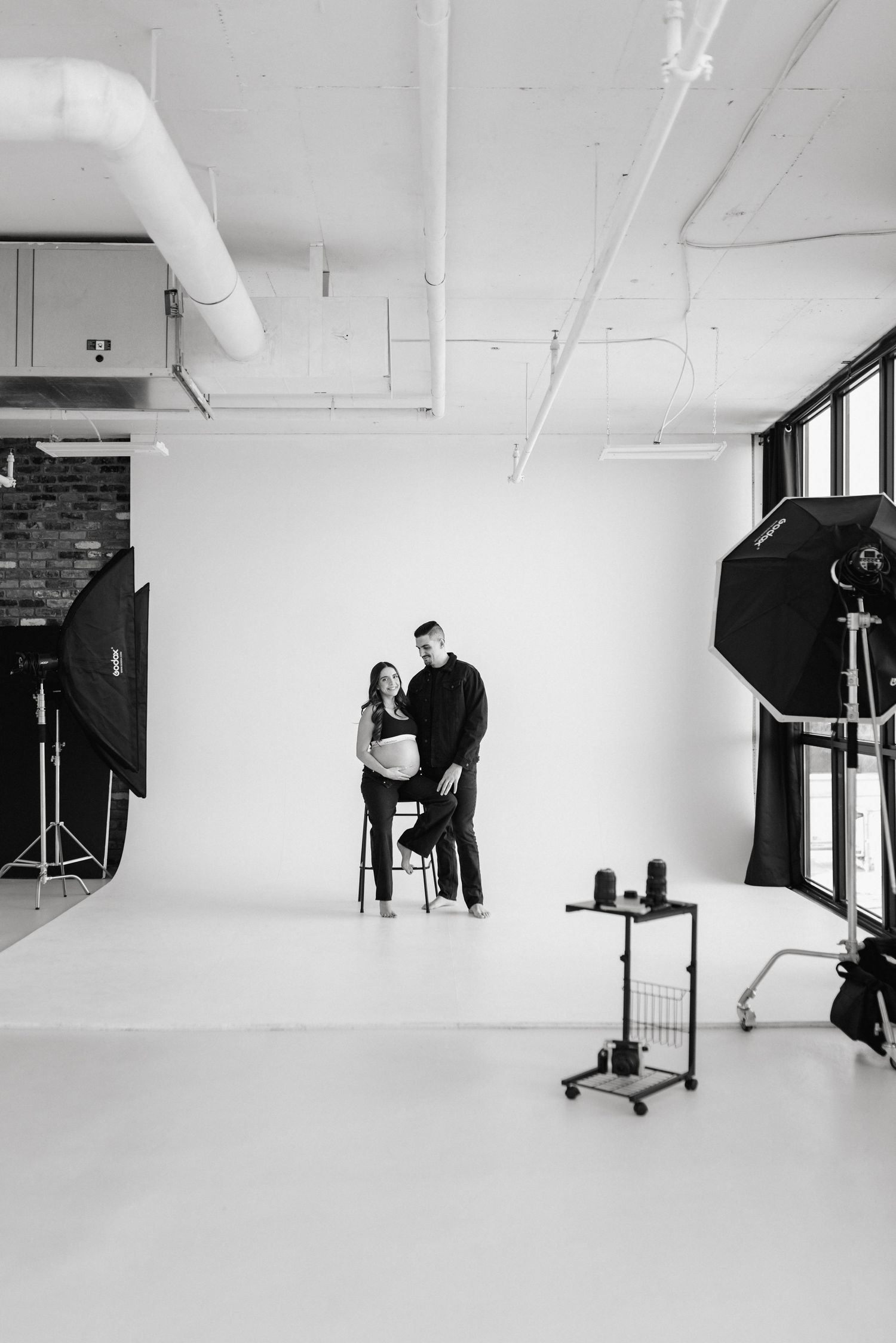 Behind-the-scenes view of photography studio setup with lighting equipment.