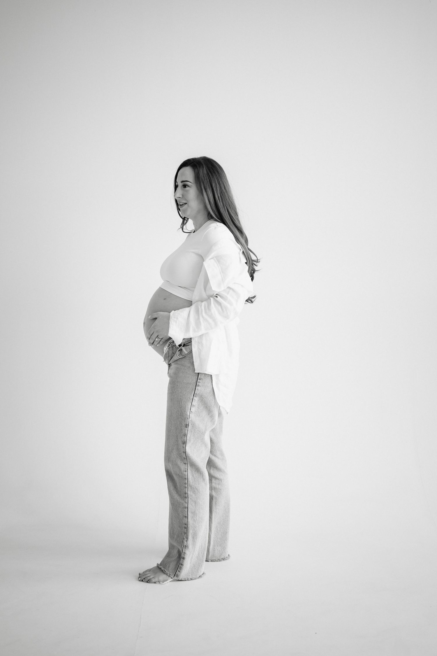 Series of artistic black and white photos showing gentle movements against a white background.