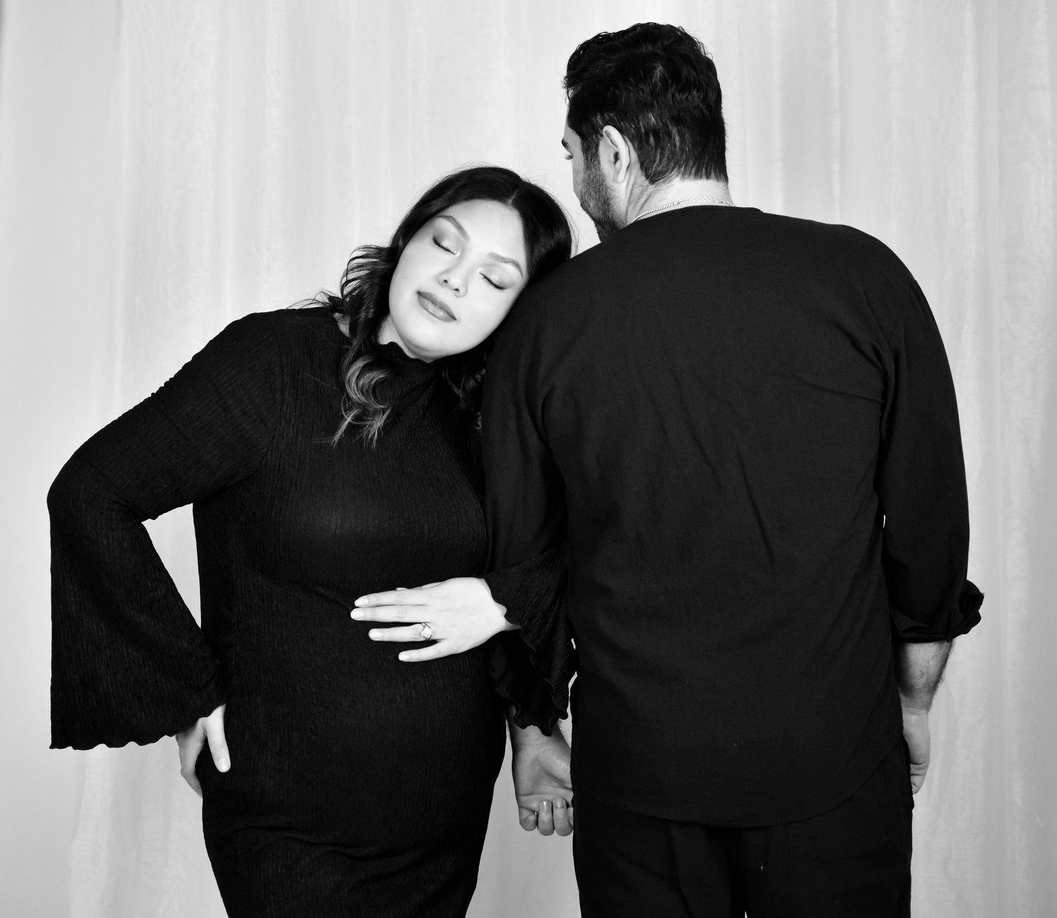 Maternity couple in a black and white photo at their photo session photographed by Precious Keepsakes Photography in San Antonio.