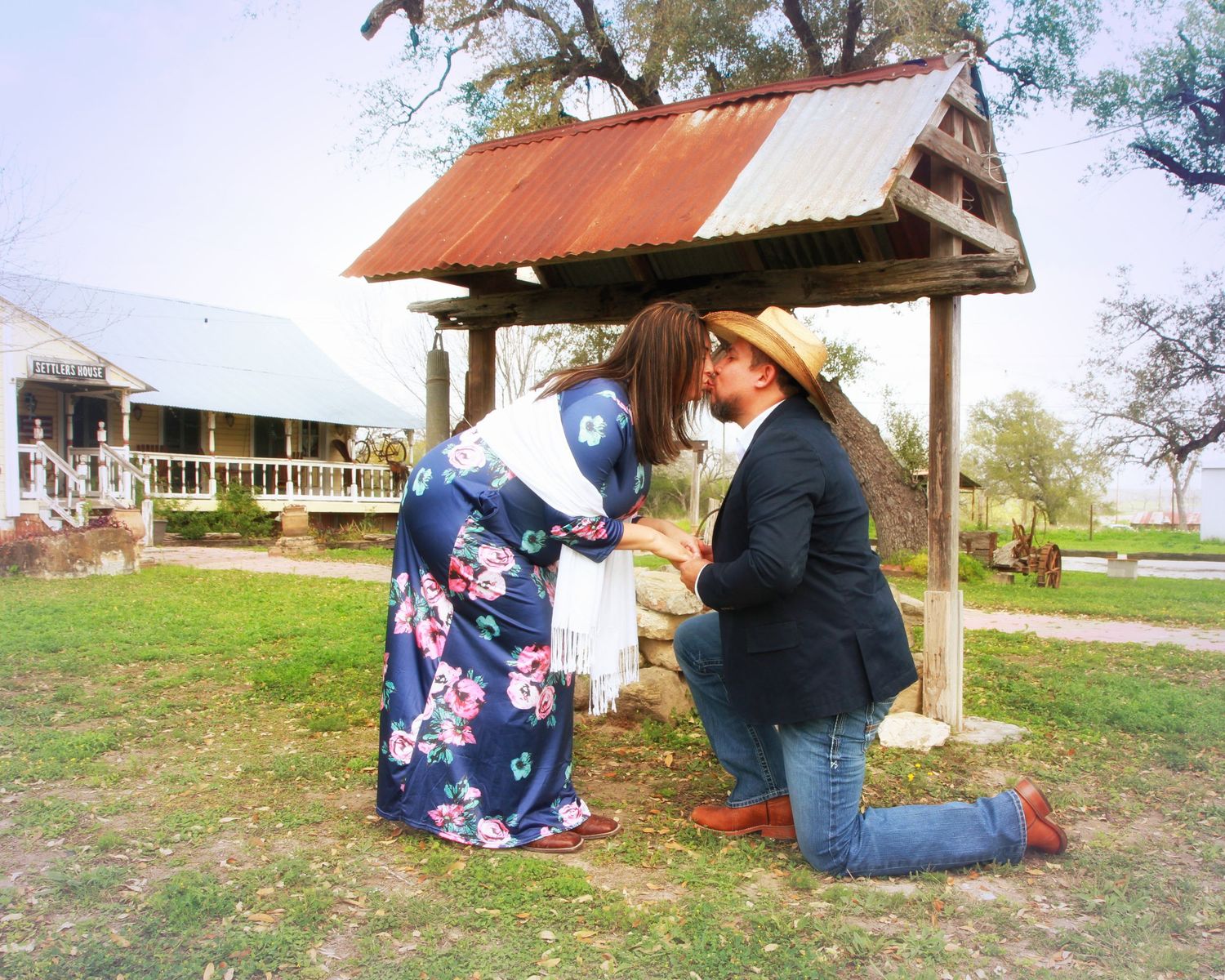 Rustic outdoor proposal setting with wooden shelter and countryside backdrop. Wedding photography Texas area