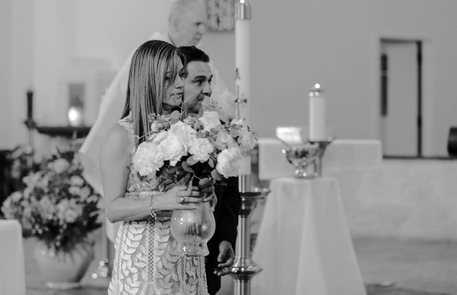 Elegant wedding ceremony setup with candles and floral arrangements in black and white, wedding photography Texas area photographer