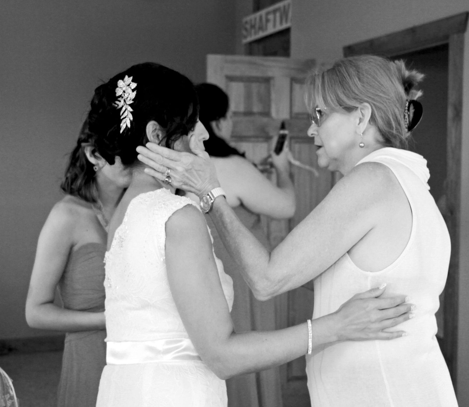 Black and white photo series captures tender moments between wedding party members. San Antonio wedding photography