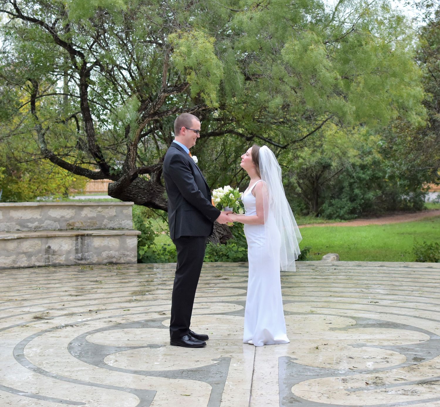 Stone patio with circular pattern designs during an outdoor wedding ceremony, San Antonio wedding photography