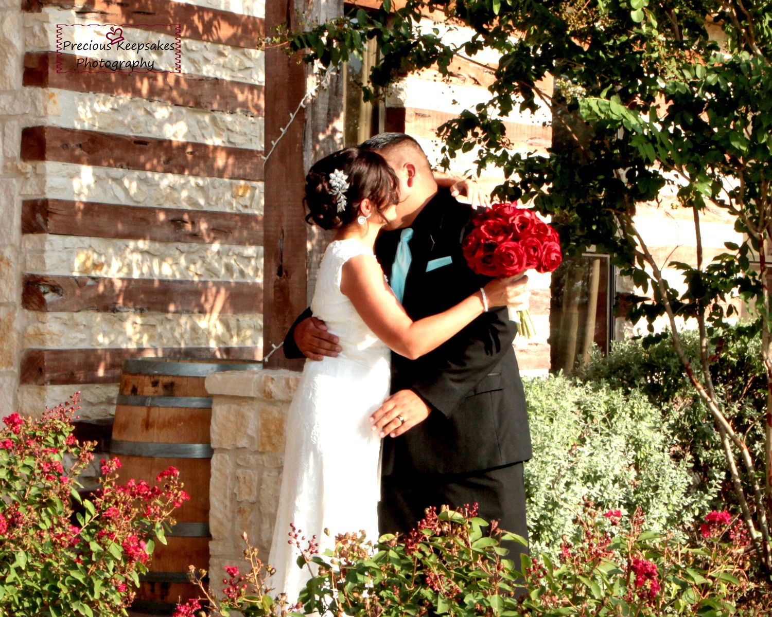 Wedding ceremony moments unfold against rustic brick backdrop with garden elements. San Antonio wedding photography